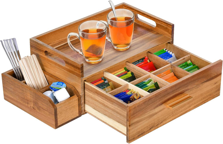 Tea scoops and wooden storage boxes arranged with loose-leaf tea for a calm and organized brewing ritual